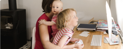 Working Mom with two kids at her desk